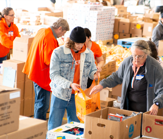 NYCM Employees volunteering at the United Way Food Bank in 2019.