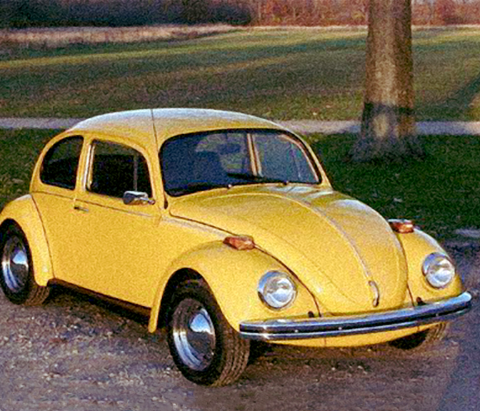 Photo of a yellow Volkswagen Beetle in the 1970's.
