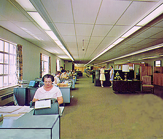Photo of part of the NYCM Insurance office with workers in the 1970's.